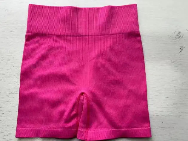 Pantalones cortos de punto acanalados para mujer, shorts de yoga sin costuras, shorts elásticos de cintura alta, shorts sexys para realzar la cadera, pantalones de tres cuartos para ciclismo y running.