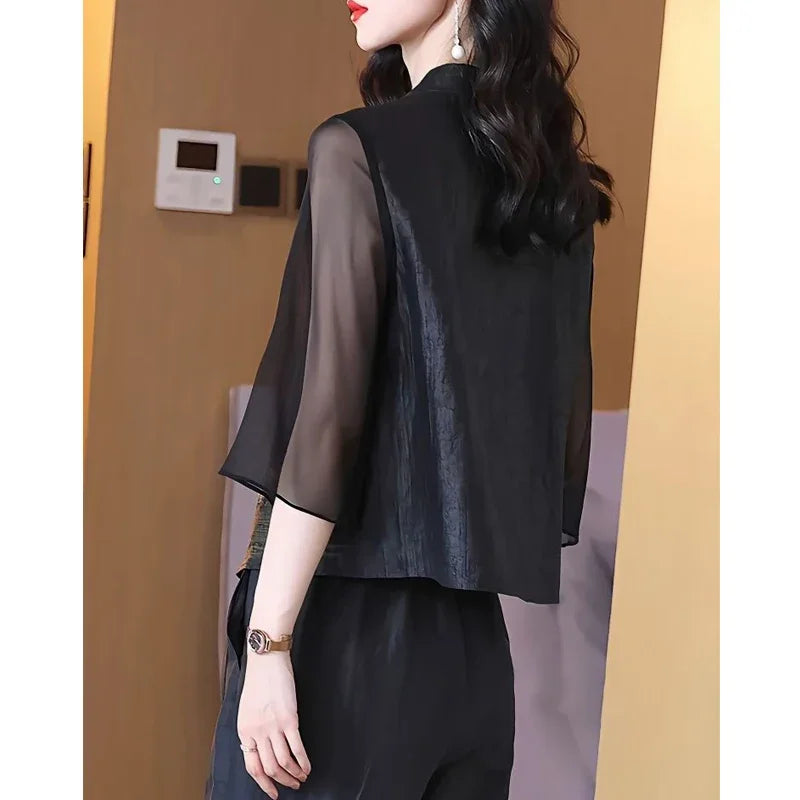 Blusa asimétrica vintage de seda bordada