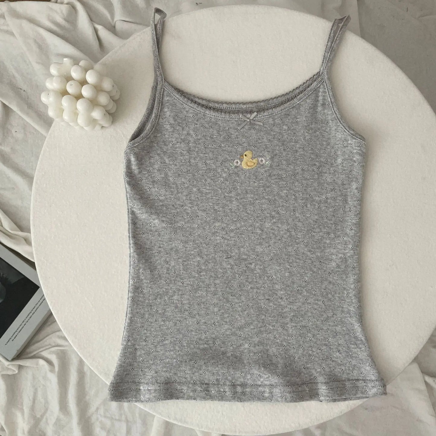Top corto Floral con ojetes y lazo