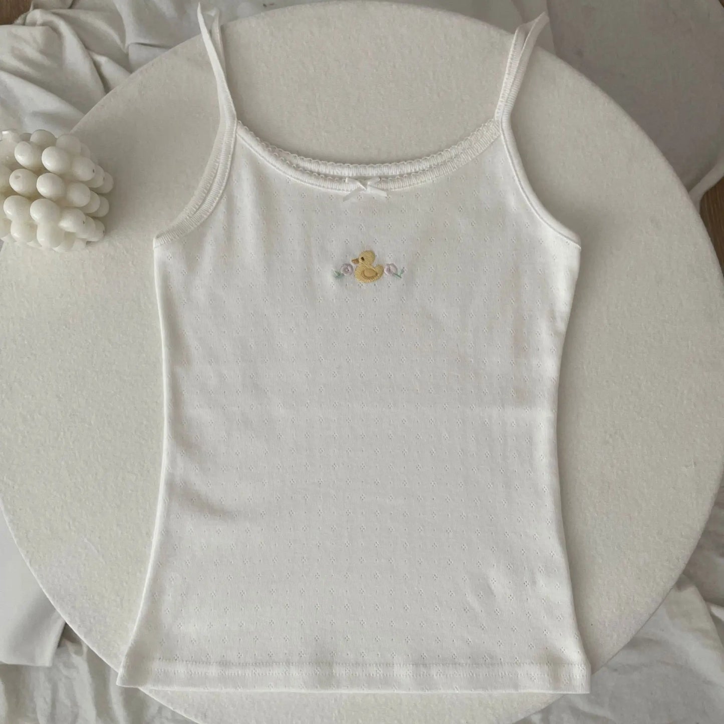 Top corto Floral con ojetes y lazo