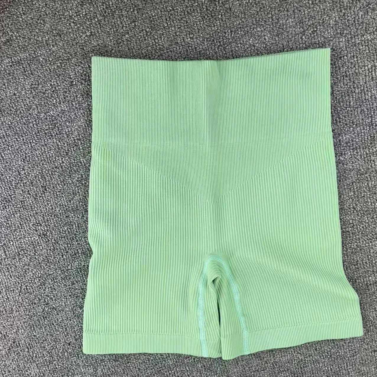 Pantalones cortos de punto acanalados para mujer, shorts de yoga sin costuras, shorts elásticos de cintura alta, shorts sexys para realzar la cadera, pantalones de tres cuartos para ciclismo y running.