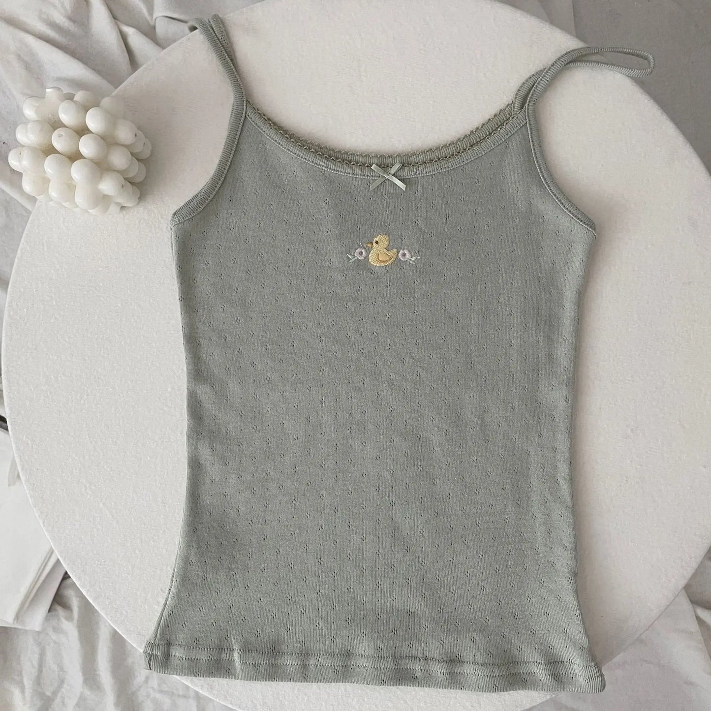 Top corto Floral con ojetes y lazo
