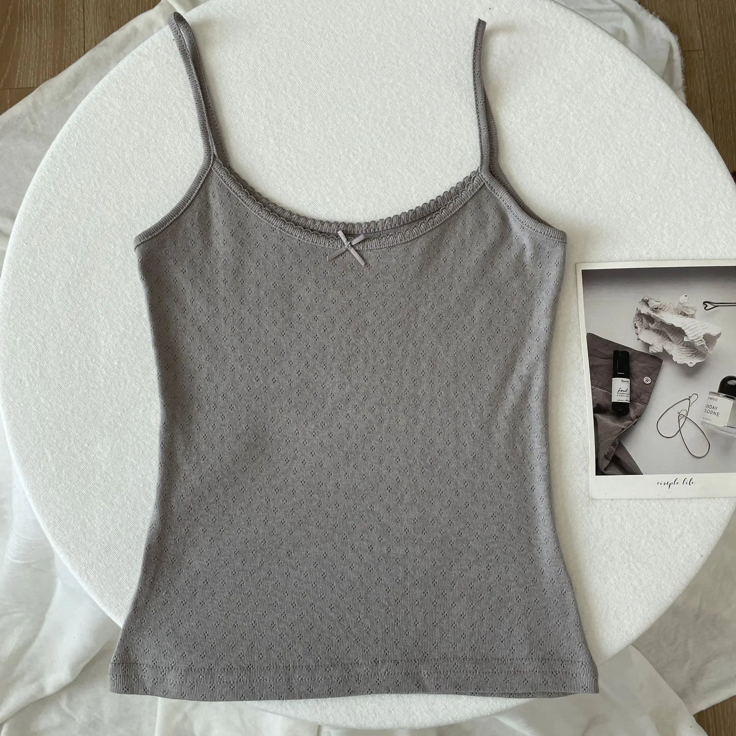 Top corto Floral con ojetes y lazo