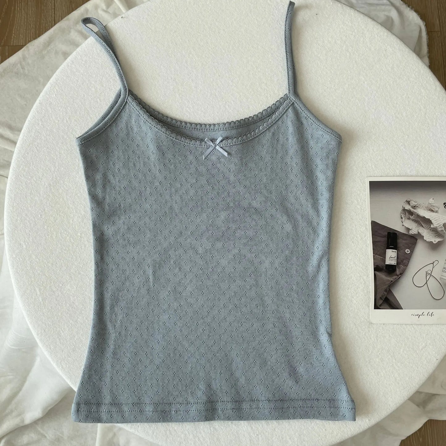 Top corto Floral con ojetes y lazo