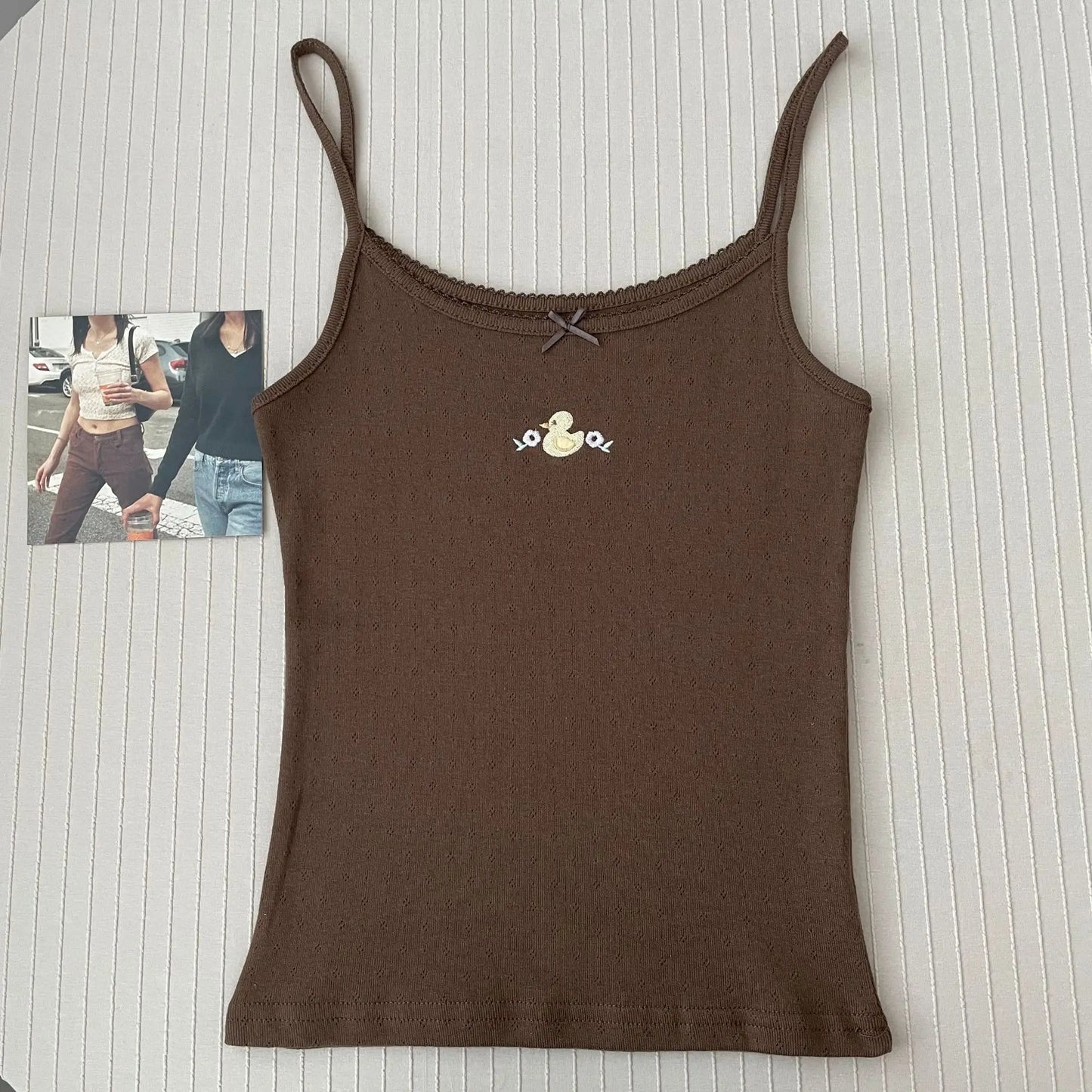 Top corto Floral con ojetes y lazo