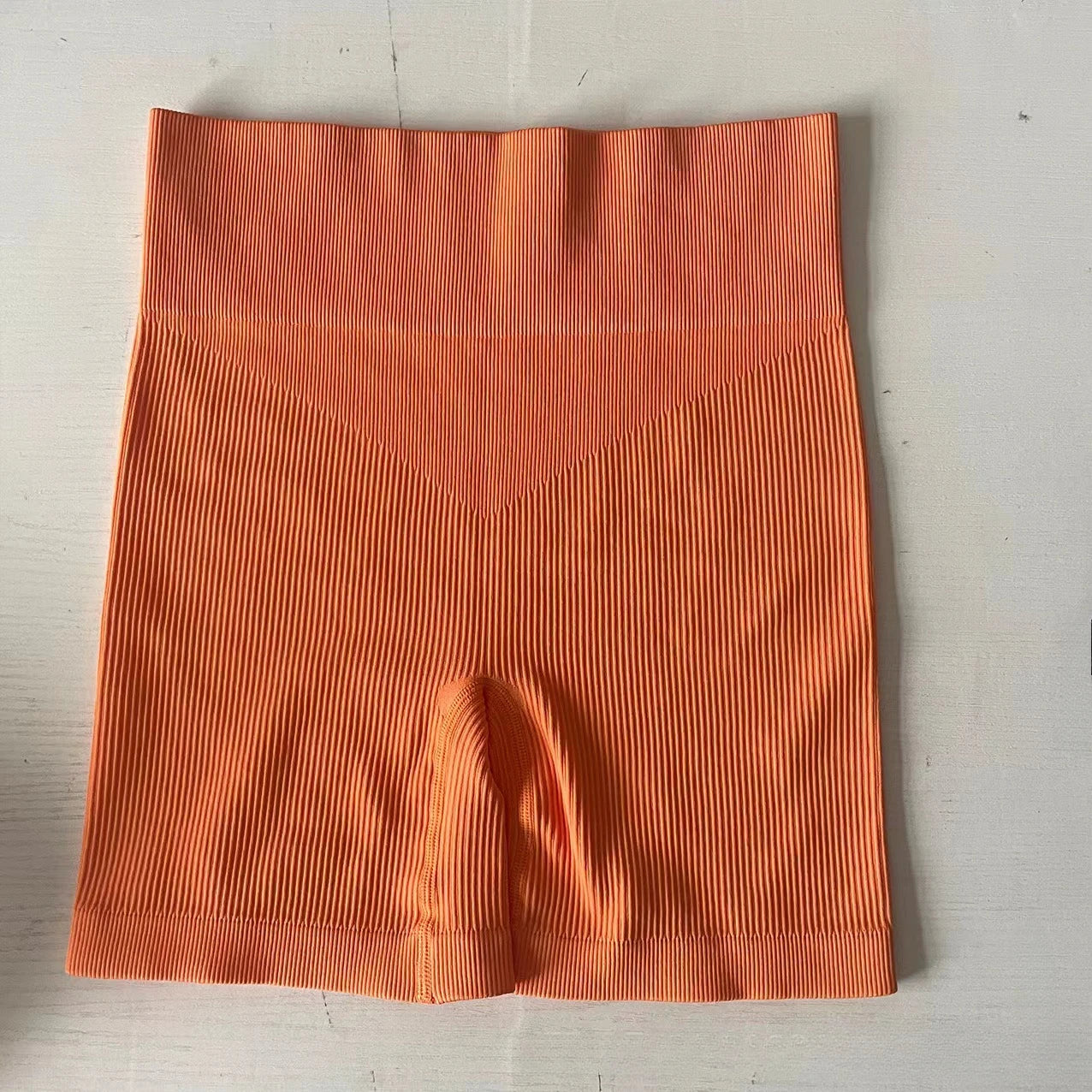 Pantalones cortos de punto acanalados para mujer, shorts de yoga sin costuras, shorts elásticos de cintura alta, shorts sexys para realzar la cadera, pantalones de tres cuartos para ciclismo y running.